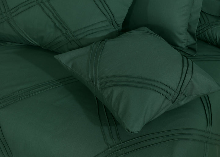 green design on bed sheet